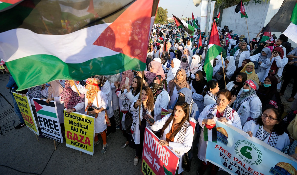 Supporters of Karachi media forum chant slogans during a demonstration against Israeli airstrikes on Gaza, and to show solidarity with Palestinian people, in Karachi, Pakistan, on December 10, 2023. (AP)