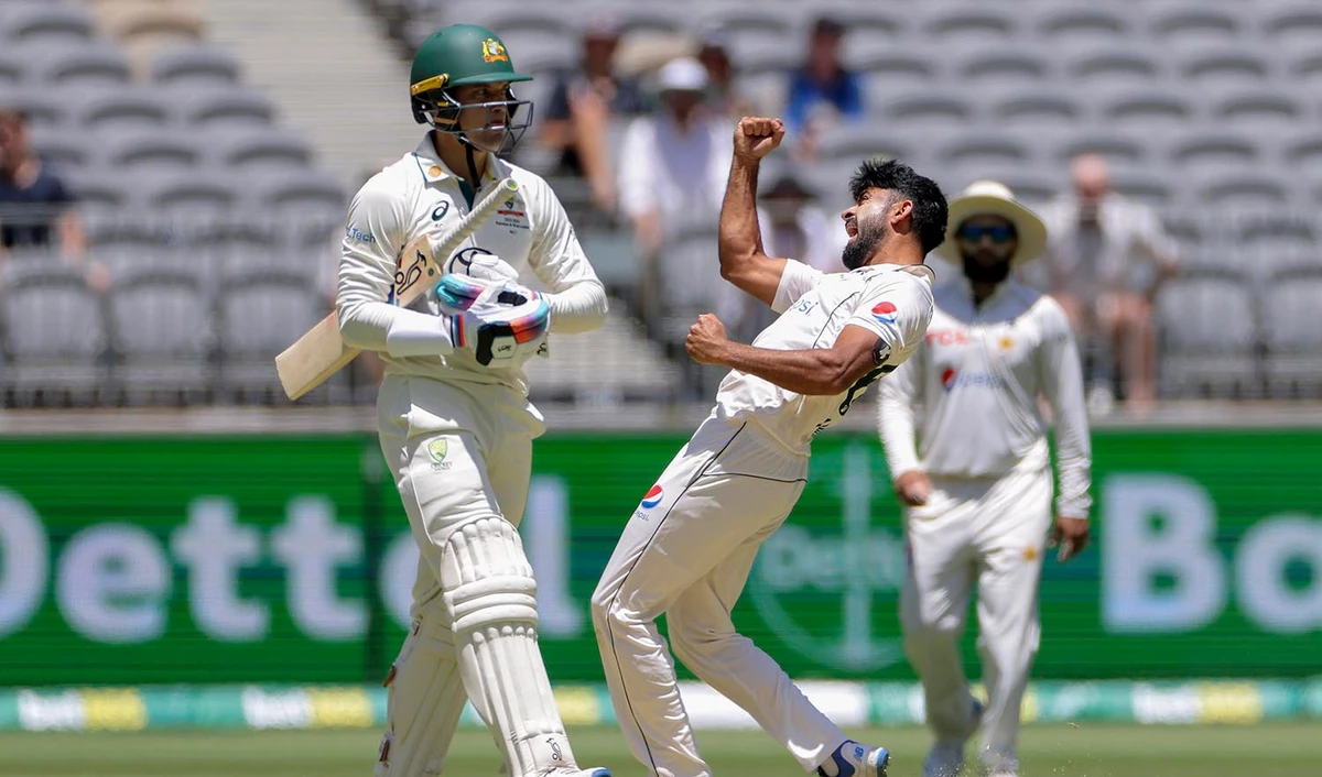 Aamir Jamal of Pakistan celebrates after taking the wicket of Alex Carey, left, of Australia during play on the second day of the first cricket test between Australia and Pakistan in Perth, Australia, on December 15, 2023. (AAP Image via AP)