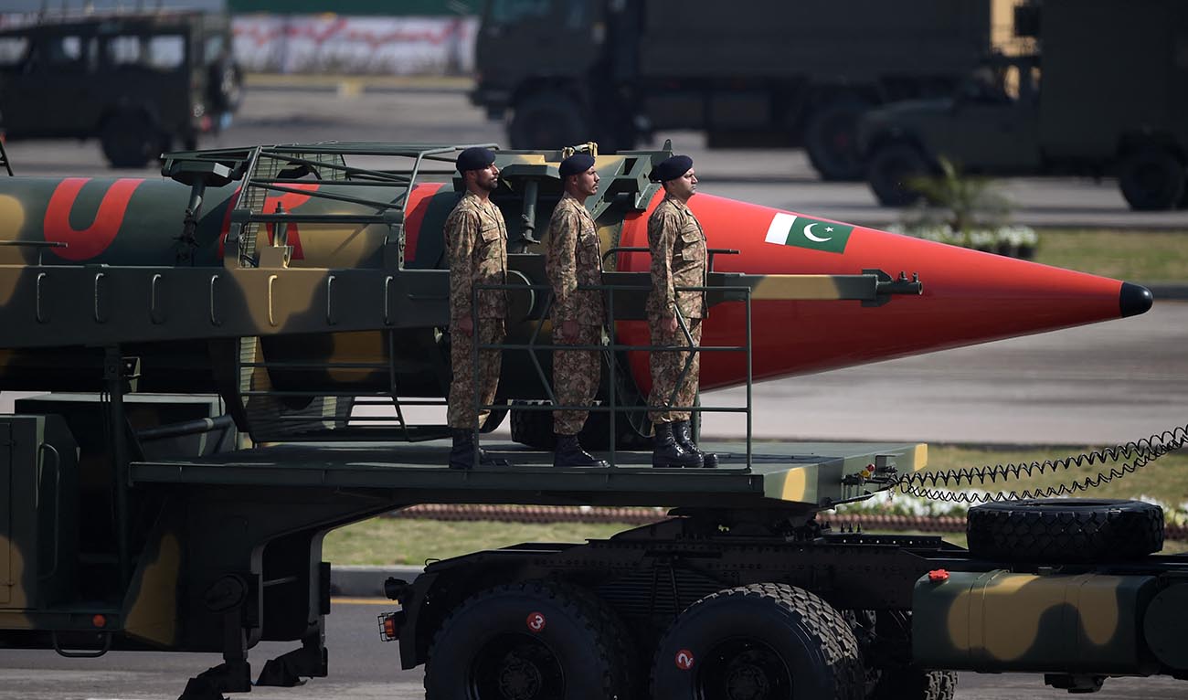 Pakistani military personnel stand beside a Ghauri nuclear-capable missile during a Pakistan Day military parade in Islamabad on March 23, 2017. (AFP/File)