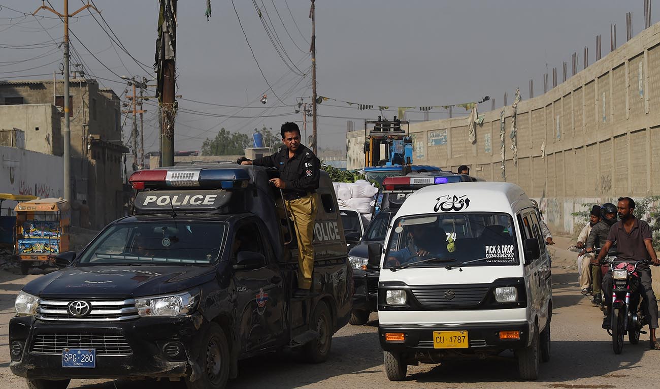 Policemen patrol along a street in Karachi on November 2, 2023. (AFP/File)