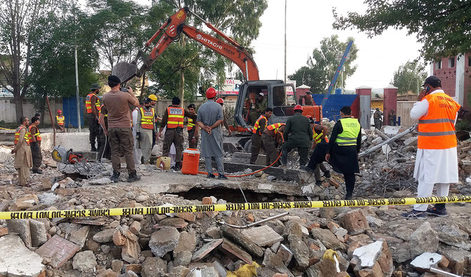 In this file photo, taken on September 29, 2023, rescue workers search for blast victims in the debris of a collapsed mosque following a suicide attack in Hangu. (AFP)