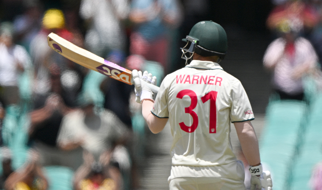 Australia’s David Warner celebrates reaching his half century (50 runs) during day four of the third cricket Test match between Australia and Pakistan at the Sydney Cricket Ground in Sydney on January 6, 2024. (AFP)