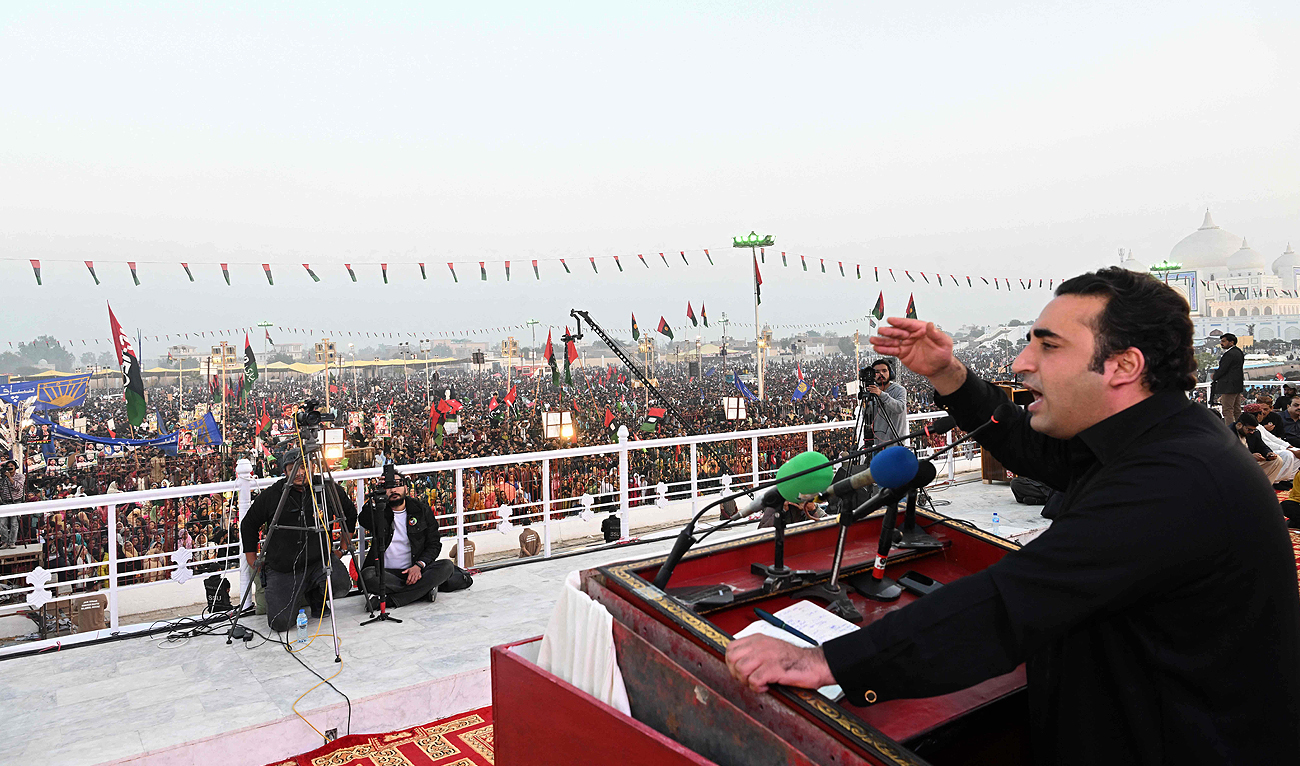 Pakistan Peoples' Party (PPP) chairman Bilawal Bhutto Zardari (R) addresses a public meeting at a general elections 2024 campaign on the death anniversary of his mother and slain former Pakistan’s premier Benazir Bhutto in the Garhi Khuda Bakhsh village, Larkana on December 27, 2023. (AFP)
