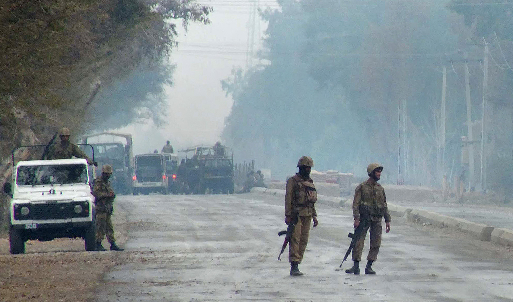 Pakistani troops patrol near the military checkpost following an attack by militants in the Sari Norang area of Lakki Marwat district, Pakistan, on February 2, 2013. (AFP/File)