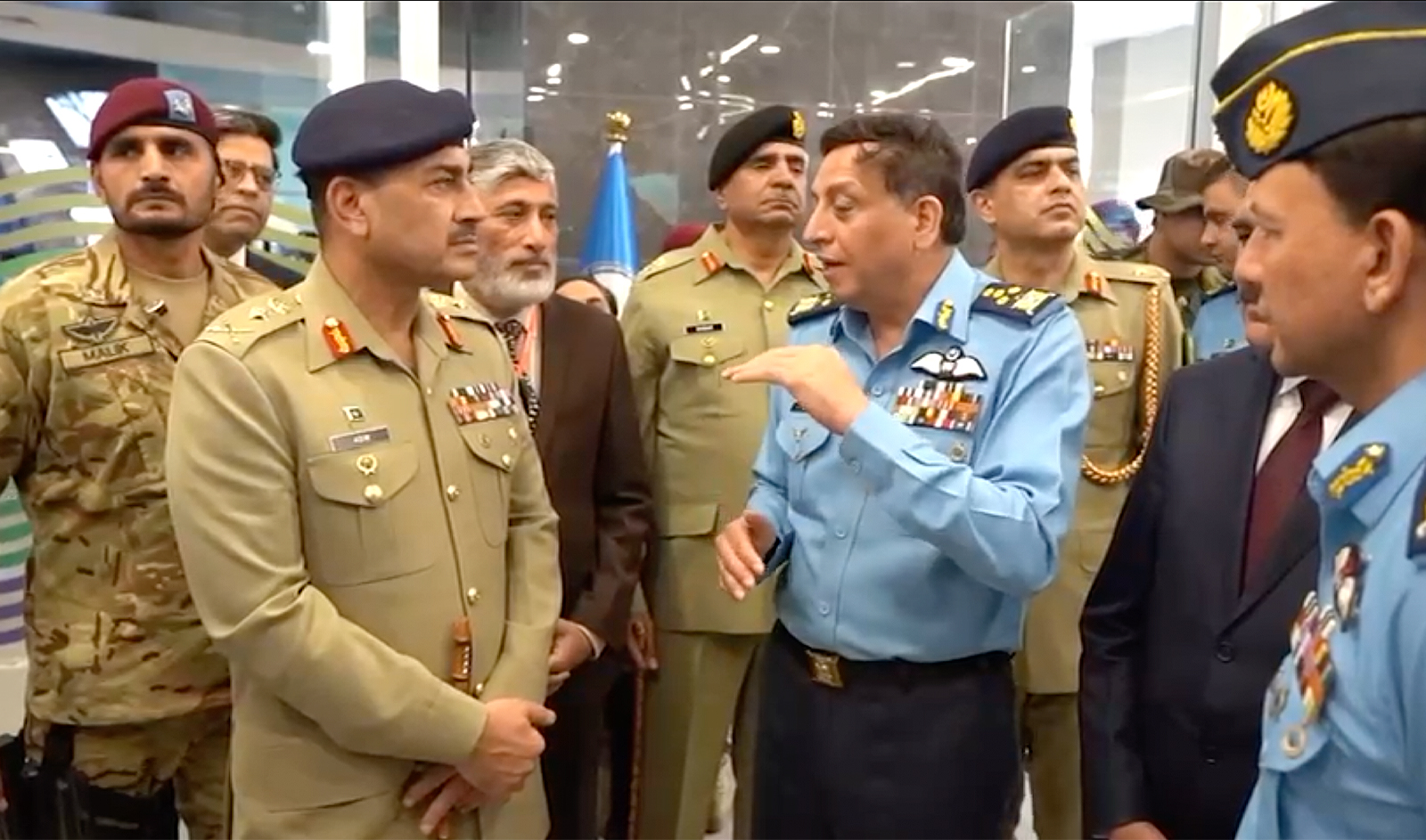 Chief of the Air Staff Zaheer Ahmed Baber Sidhu (center right) briefs Chief of Army Staff General Asim Munir (center left) as the latter inaugurated the second chapter of National Aerospace Science and Technology Park in Karachi, Pakistan, on January 12, 2024. (ISPR)
