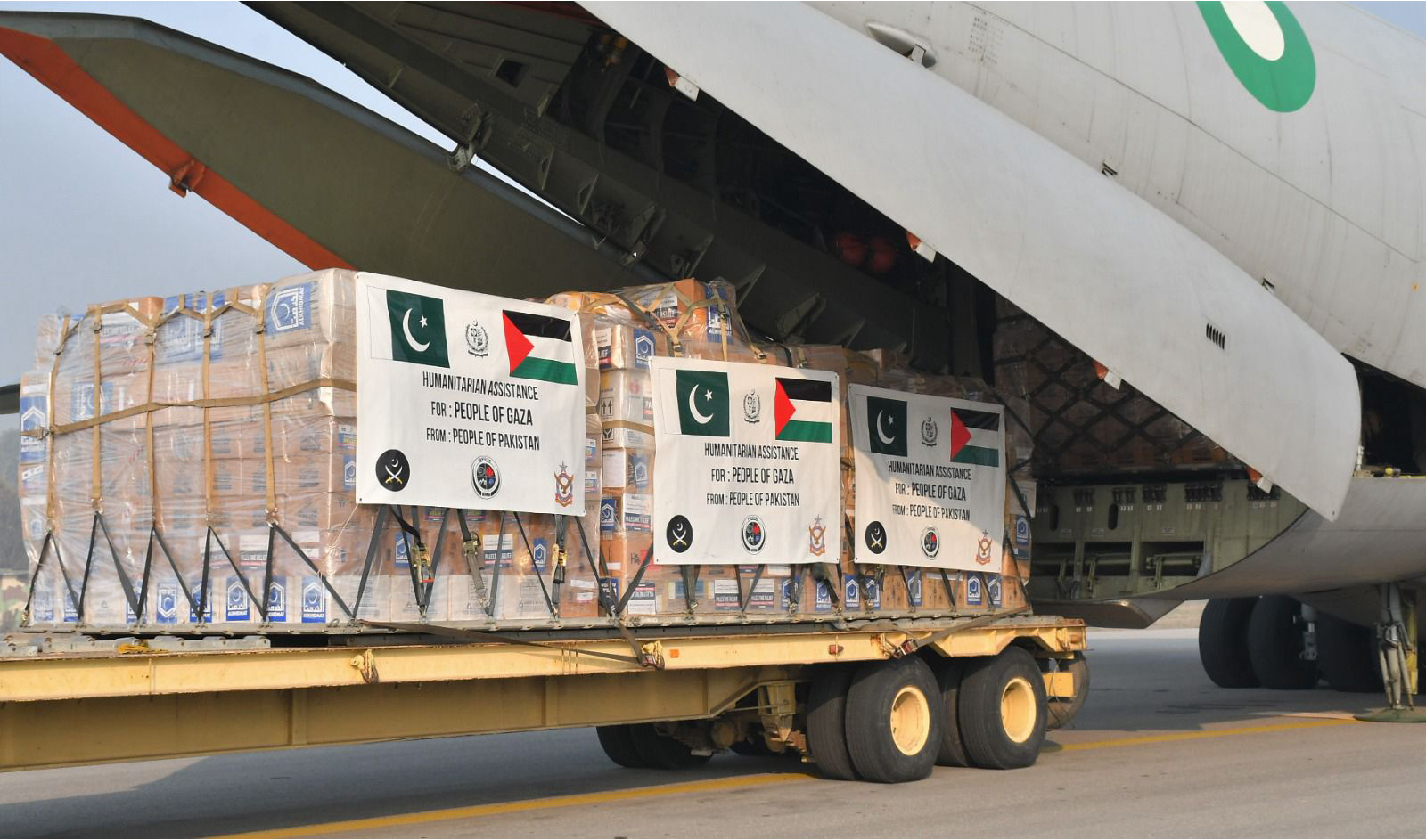 The pictured released on January 13, 2024, by Pakistan's Foreign Office shows shows humanitarian aid bound for the Gaza Strip being loaded into a military aircraft at Nur Khan Base in Rawalpindi, Pakistan. (NDMA)