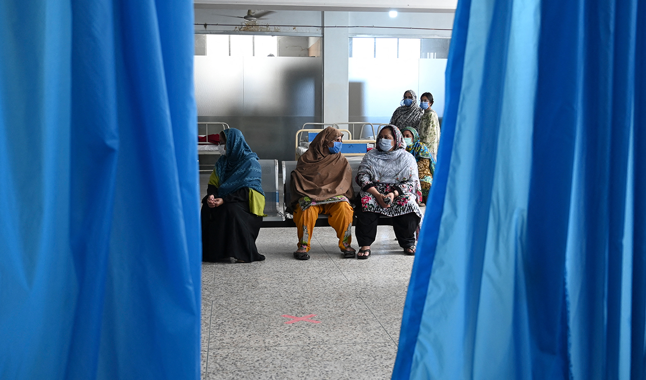 People wait for their turn to get a Covid-19 coronavirus Sinovac vaccine at the Red Crescent vaccination centre in Rawalpindi on May 24, 2021. (AFP/File)