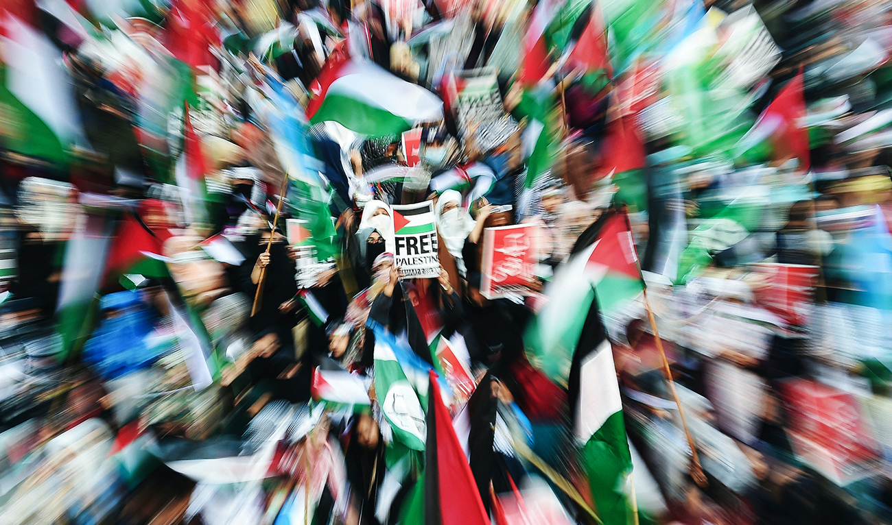 Supporters of Jamaat e Islami (JI) display placards and Palestine's flags during a pro-Palestinian march in Karachi on January 14, 2024. (AFP)