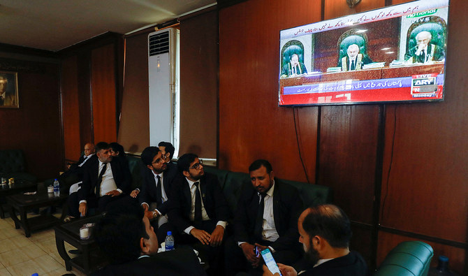 Lawyers, some of them look on television screen, displaying the live broadcast of the proceeding from the Supreme Court of Pakistan, at the Sindh High Court Bar Association in Karachi, Pakistan September 18, 2023. (REUTERS/File)