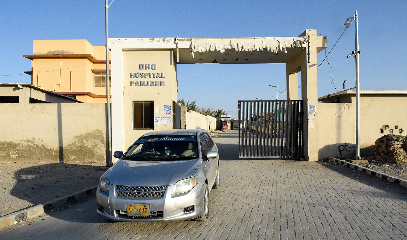 A car leaves the district headquarter hospital (DHQ) in Panjgur town of Balochistan province on January 17, 2024 where victims of an Iranian air strike were moved earlier in the day. (AFP)