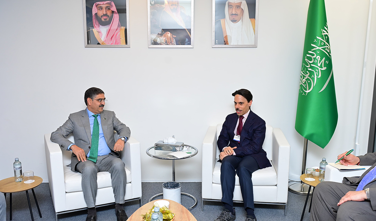 In this handout photo, taken and released by Prime Minister's Office, Pakistan's Interim Prime Minister Anwaar-ul-Haq Kakar (left) meets Saudi Arabia's Foreign Minister Faisal bin Farhan bin Abdullah on the sidelines of the World Economic Forum in Davos, Switzerland on January 18, 2023. (Photo courtesy: PMO)
