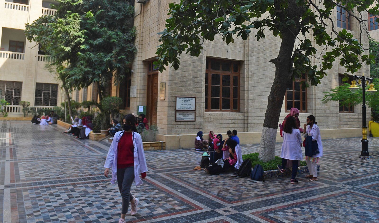 In this picture taken on January 13, 2022, students gather at a yard of the Dow University of Health Sciences, in Karachi, Pakistan. (AFP/File)