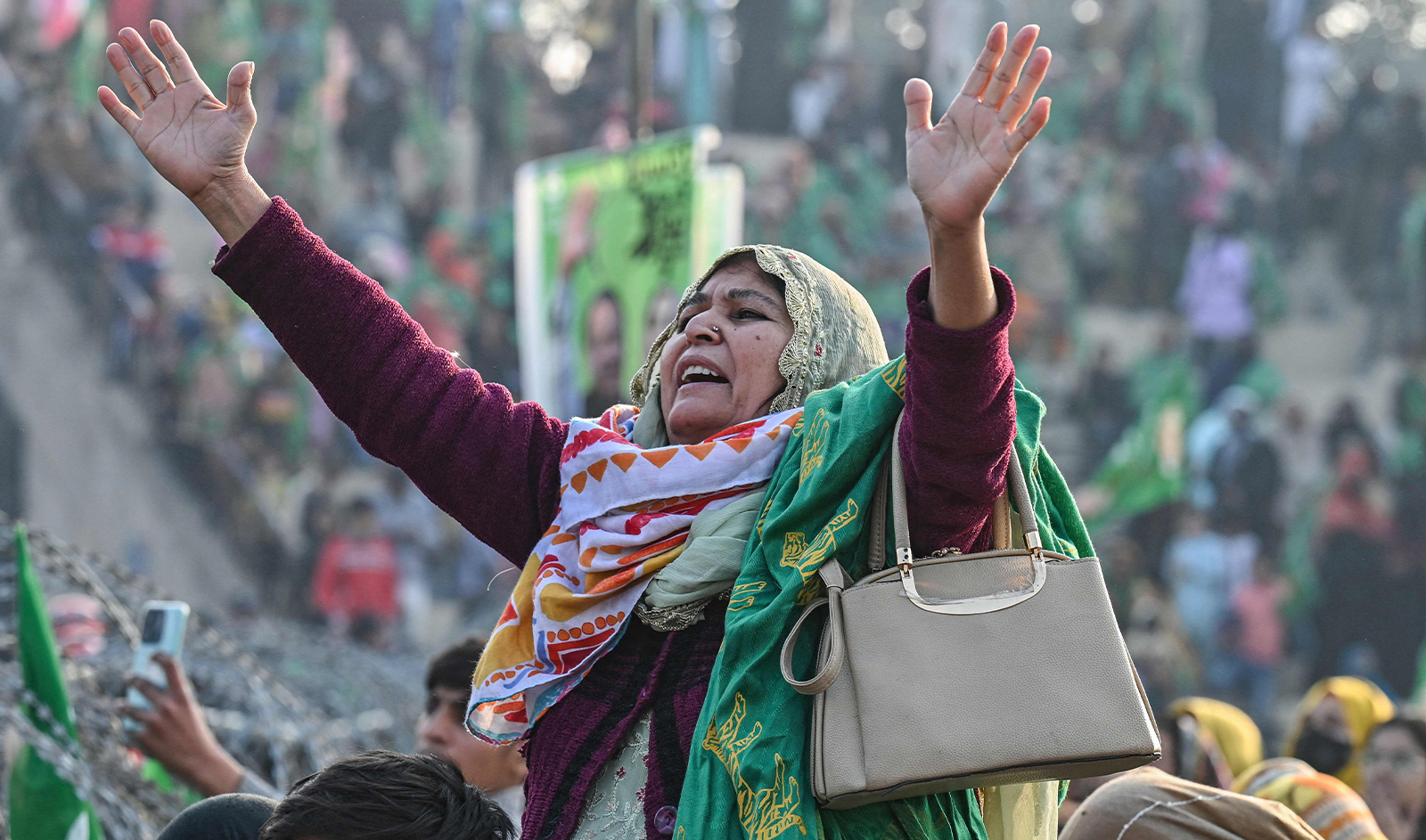A woman supporter of Nawaz Sharif, Pakistan's former Prime Minister and leader of the Pakistan Muslim League (PML) party, cheers during an election campaign rally in Hafizabad of Punjab province on January 18, 2024. (AFP)