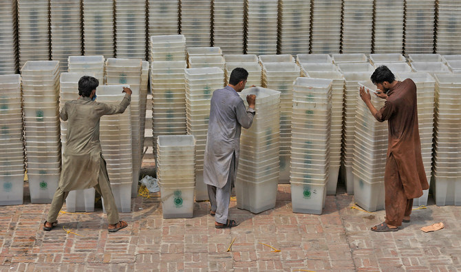 Workers sort out ballot boxes before dispatching them to polling stations ahead of general election, at the Election Commission office in Peshawar, Pakistan on July 22, 2018. (REUTERS/File)