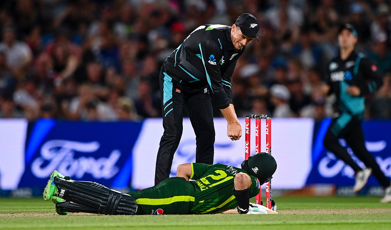 Mitchell Santner of New Zealand (top) checks on Mohammad Nawaz of Pakistan after he fell during their T20 cricket match in Christchurch on January 19, 2024. (AP)