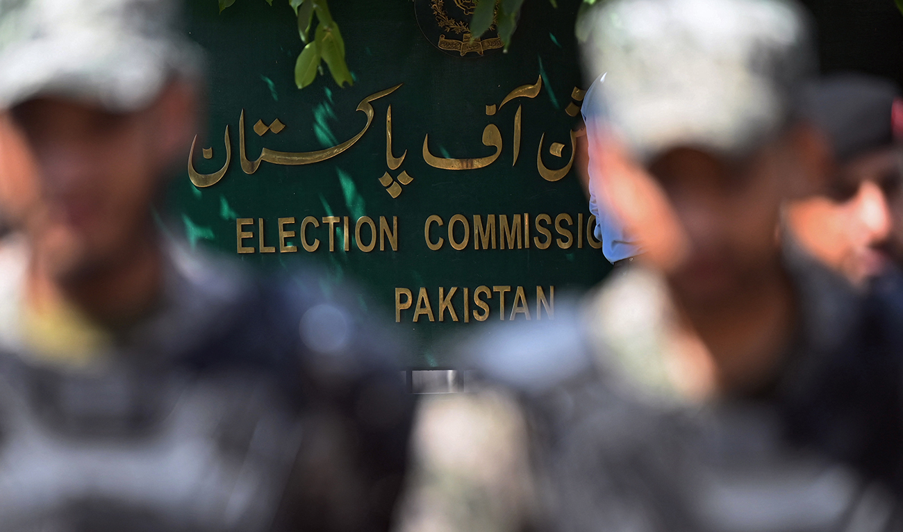 Paramilitary soldiers stand guard outside the Pakistan’s election commission building in Islamabad on August 2, 2022. (AFP/File)
