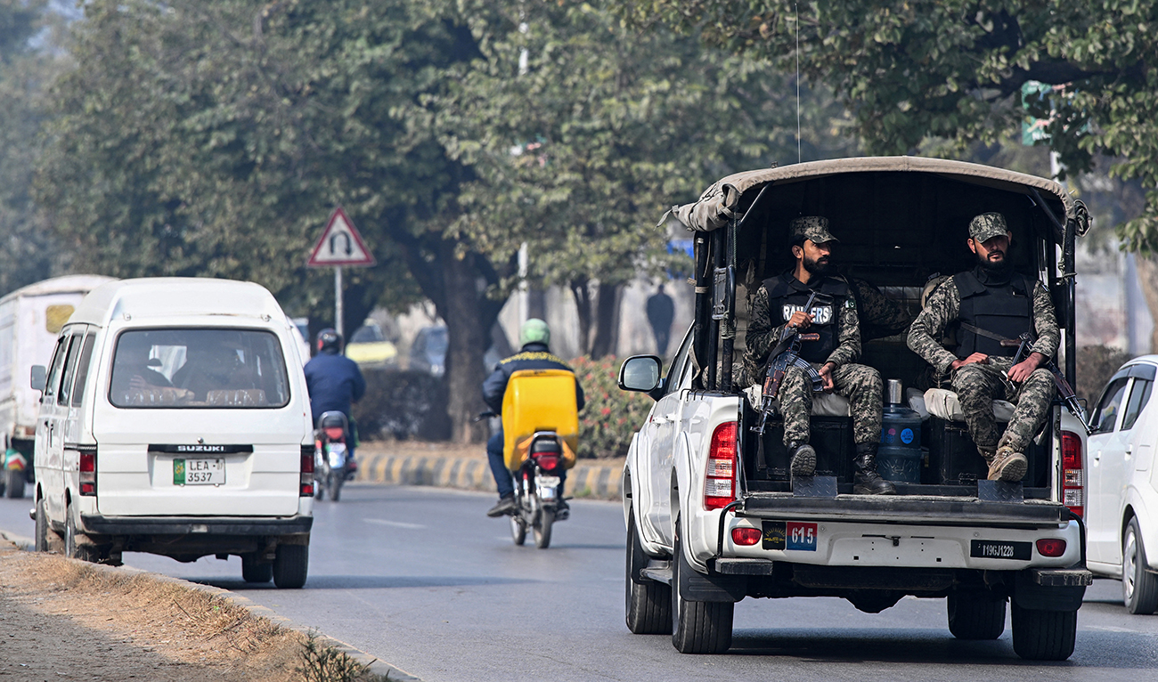 Paramilitary personnel patrolling a street ride a vehicle in Islamabad on January 22, 2024. (AFP)