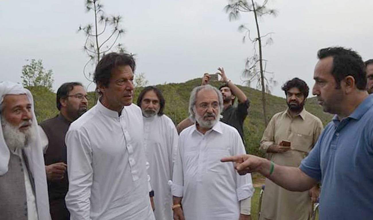 In this undated photo Rafiq Khan (right), the follower of former Pakistani prime minister Imran Khan, speaks with Khan at his Bani Gala residence in Islamabad. Rafiq, 45, devoted his life to the cricketer-turned-politician and has been with him since 1989. (Photo courtesy: Rafiq Khan)