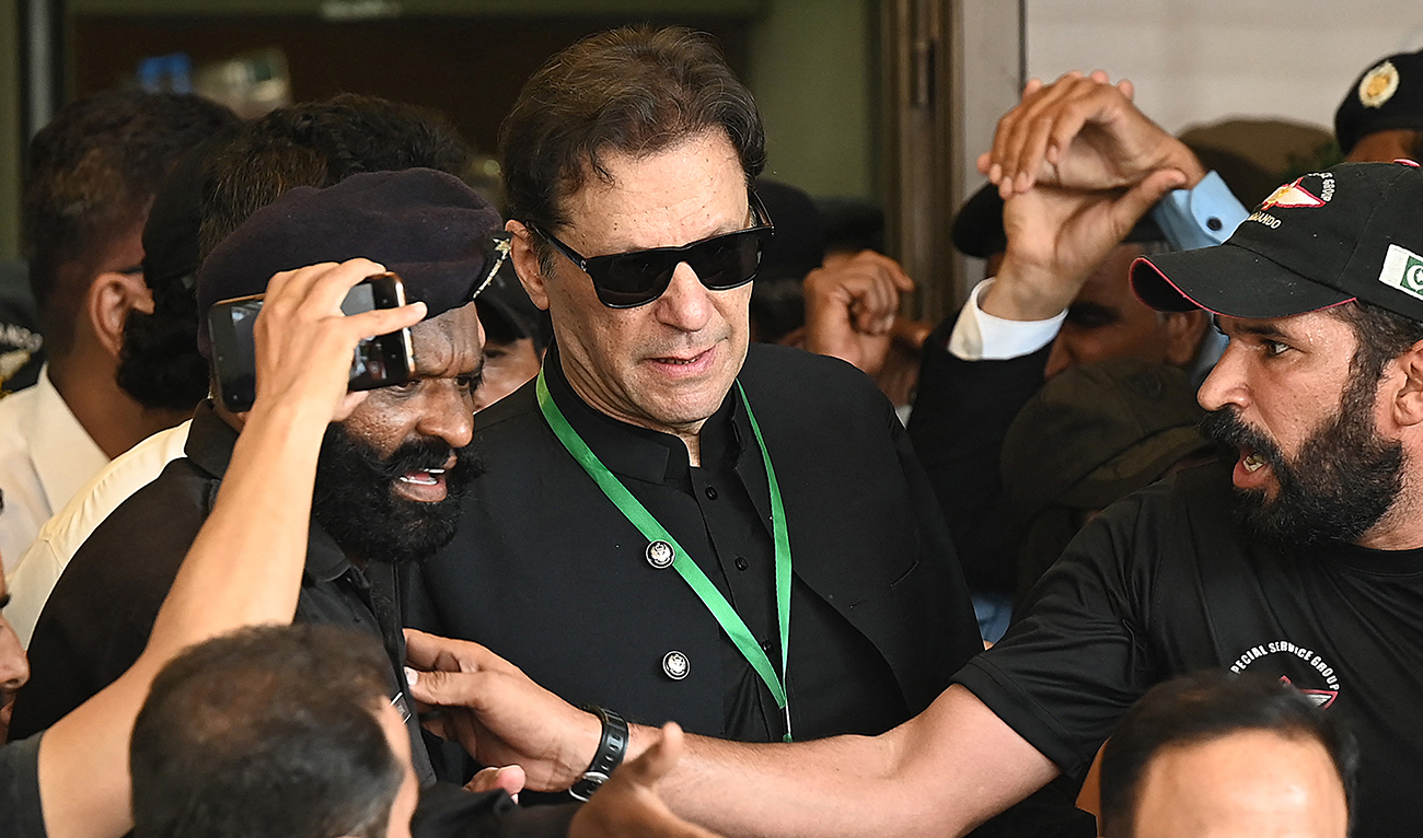 Pakistan’s former Prime Minister Imran Khan (C) leaves after appearing in the Supreme Court in Islamabad on July 24, 2023. (AFP/File)