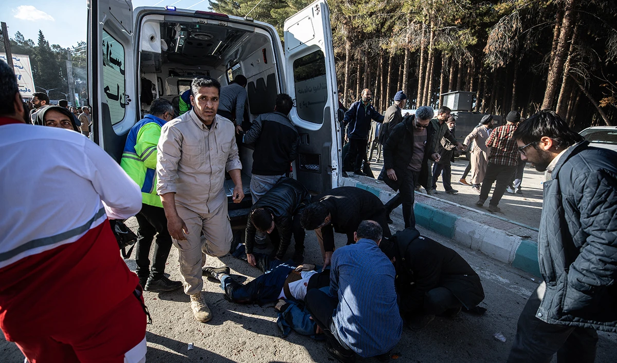 Iranian emergency services arrive at the site where two explosions in quick succession struck a crowd marking the anniversary of the 2020 killing of Guards general Qasem Soleimani, near the Saheb al-Zaman Mosque in the southern Iranian city of Kerman on January 3, 2024. (AFP)