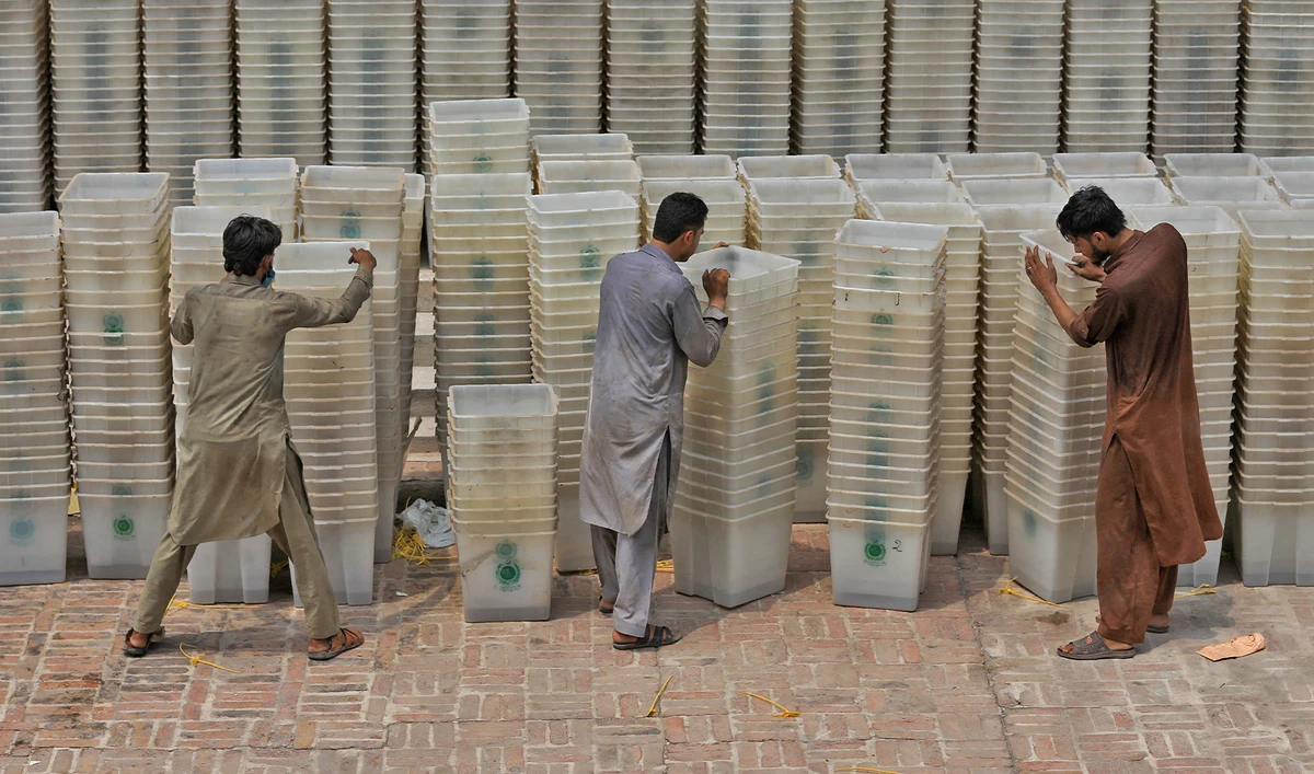 Workers sort out ballot boxes before dispatching them to polling stations ahead of general election, at the Election Commission office in Peshawar, Pakistan on July 22, 2018. (REUTERS/File)
