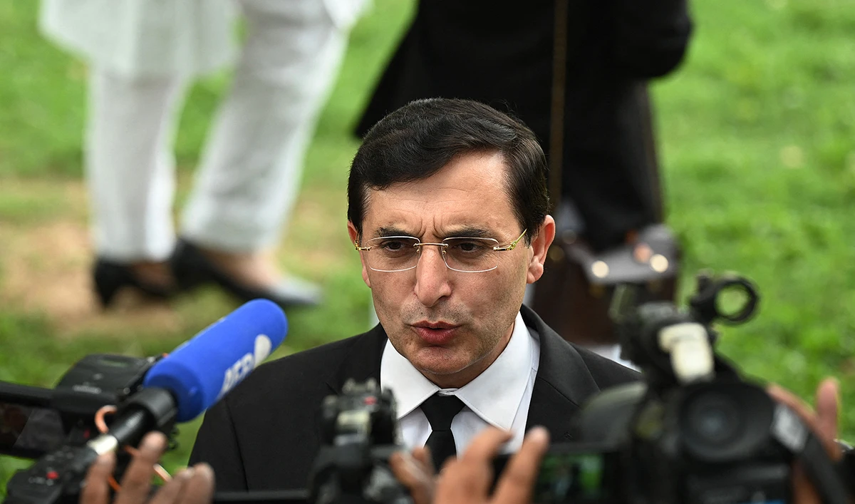 In this file photo, taken on August 9, 2023, Gohar Khan, lawyer and legal team member of former Pakistan’s Prime Minister Imran Khan, talks to the media as he arrives to attend a hearing at the High Court in Islamabad. (AFP/File)