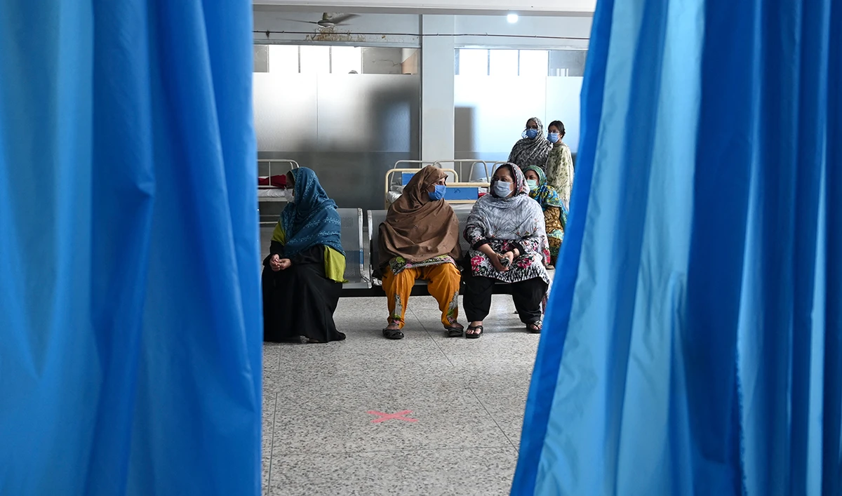 People wait for their turn to get a Covid-19 coronavirus Sinovac vaccine at the Red Crescent vaccination centre in Rawalpindi on May 24, 2021. (AFP/File)