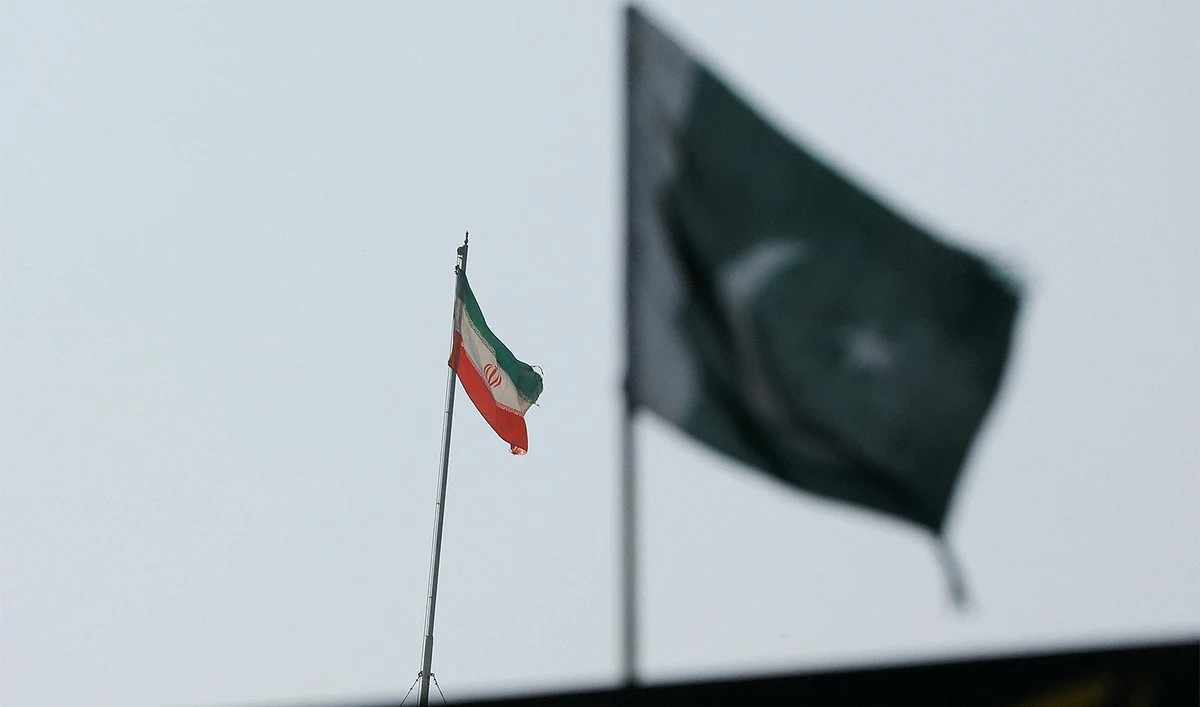 The flag of Iran is seen over its consulate building, with Pakistan's flag in the foreground, after the Pakistani foreign ministry said the country conducted strikes inside Iran targeting separatist militants, two days after Tehran said it attacked Israel-linked militant bases inside Pakistani territory, in Karachi, Pakistan, on January 18, 2024. (REUTERS)