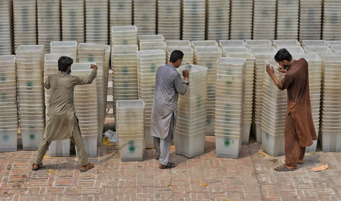 Workers sort out ballot boxes before dispatching them to polling stations ahead of general election, at the Election Commission office in Peshawar, Pakistan on July 22, 2018. (REUTERS/File)