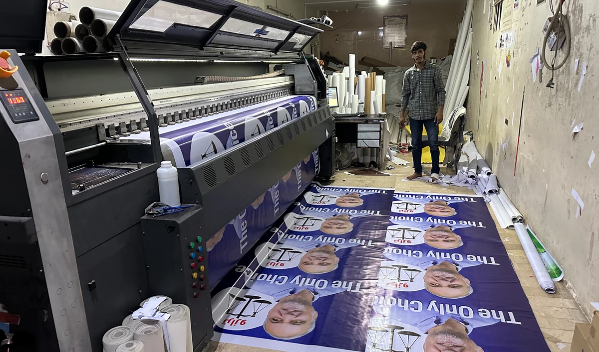 A worker prints election posters on a printing press in Karachi on January 23, 2024, ahead of the upcoming general elections. (AN Photo)