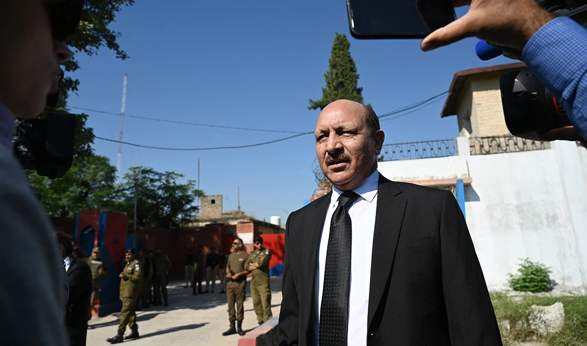 Lawyer Shah Khawar speaks with media representatives outside the Adiala Jail, in Rawalpindi on October 23, 2023. (AFP/File)