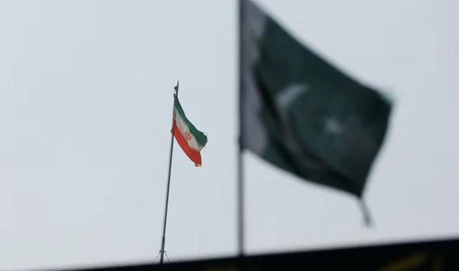 The flag of Iran is seen over its consulate building, with Pakistan's flag in the foreground, in Karachi, Pakistan on January 18, 2024. (REUTERS/File)