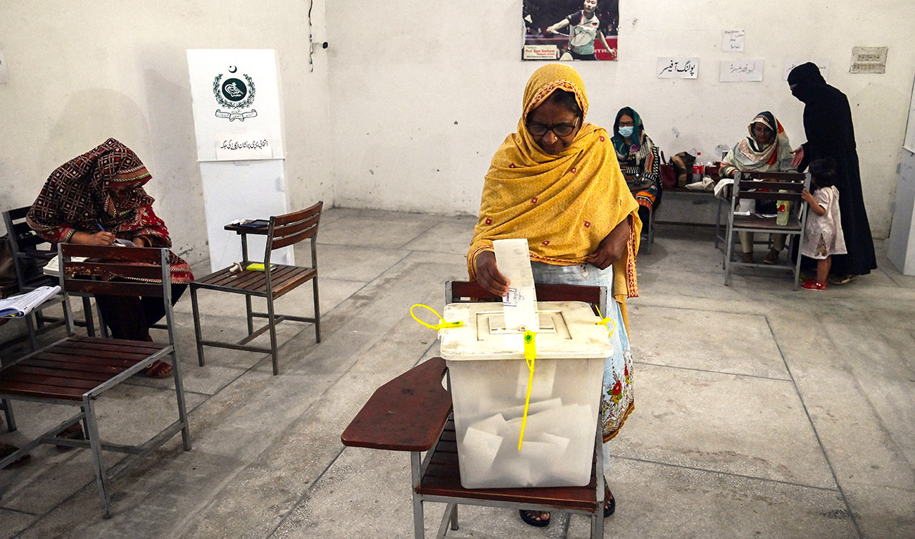 Voters cast their ballot at a polling station during the by-election in Punjab province assembly seat in Lahore on July 17, 2022. (AFP/File)