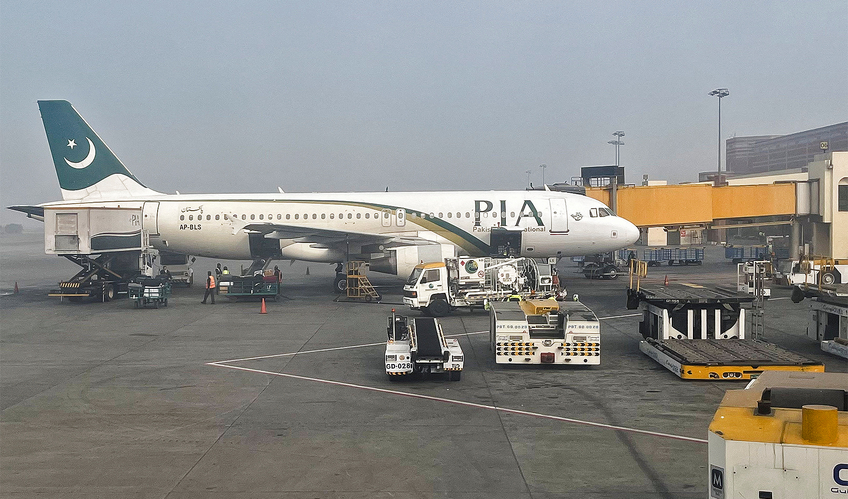 View of a Pakistan International Airlines (PIA) passengers plane, taken through a glass panel, at the Allama Iqbal International Airpor in Lahore, Pakistan on January 29, 2024. (REUTERS)