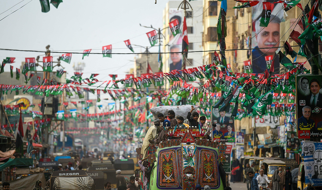 Pakistan People's Party (PPP) flags are hung across a street in Karachi on February 2, 2024, ahead of the general elections. (AFP)