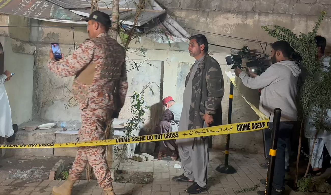 Security personnel inspect the site of a bomb blast in Karachi on February 2, 2024. (AN Photo)