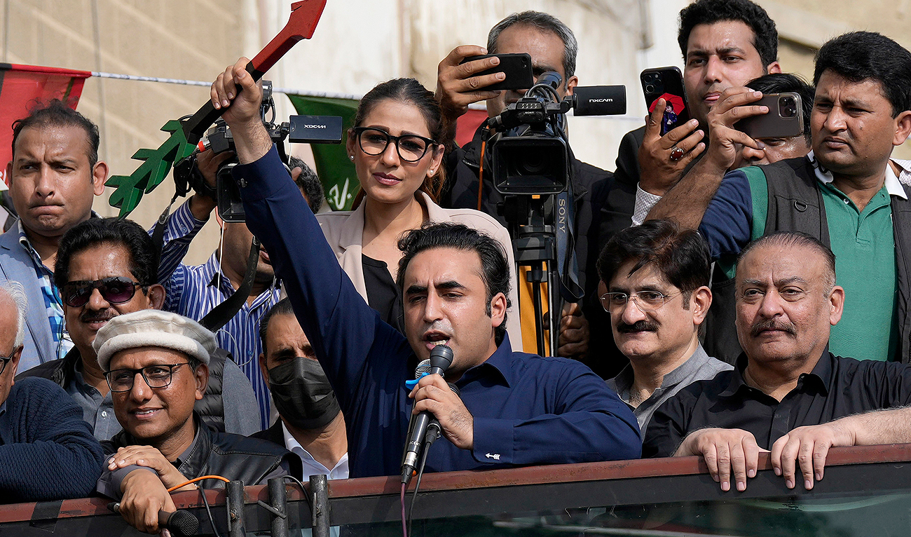 Bilawal Bhutto Zardari, center, Chairman of Pakistan People's Party, raises his party's election symbol as he addresses to his supporters during an election campaign rally, in Karachi on February 5, 2024. (AP)