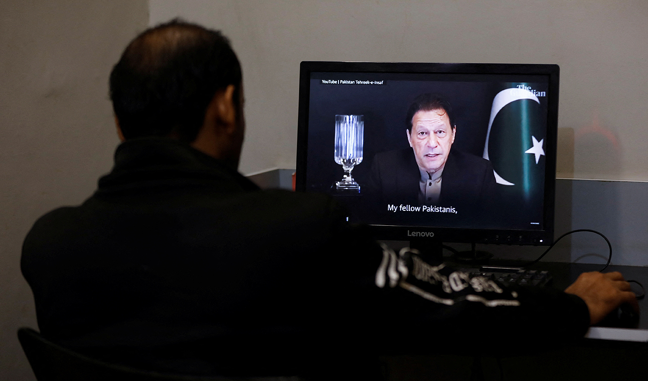 A man views a computer screen displaying the AI-crafted speech of former Prime Minister Imran Khan, to call for votes ahead of the general elections in Karachi, Pakistan February 2, 2024. (REUTERS)