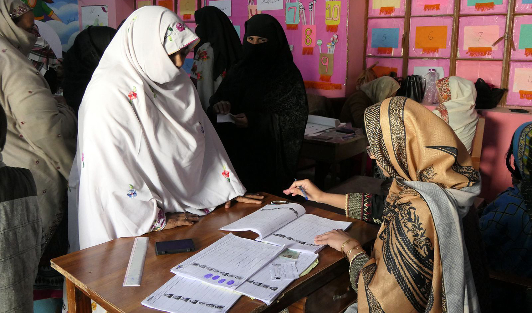 A woman casts her vote at a polling station during a general election, in Quetta, Pakistan, on February 8, 2024. (REUTERS)