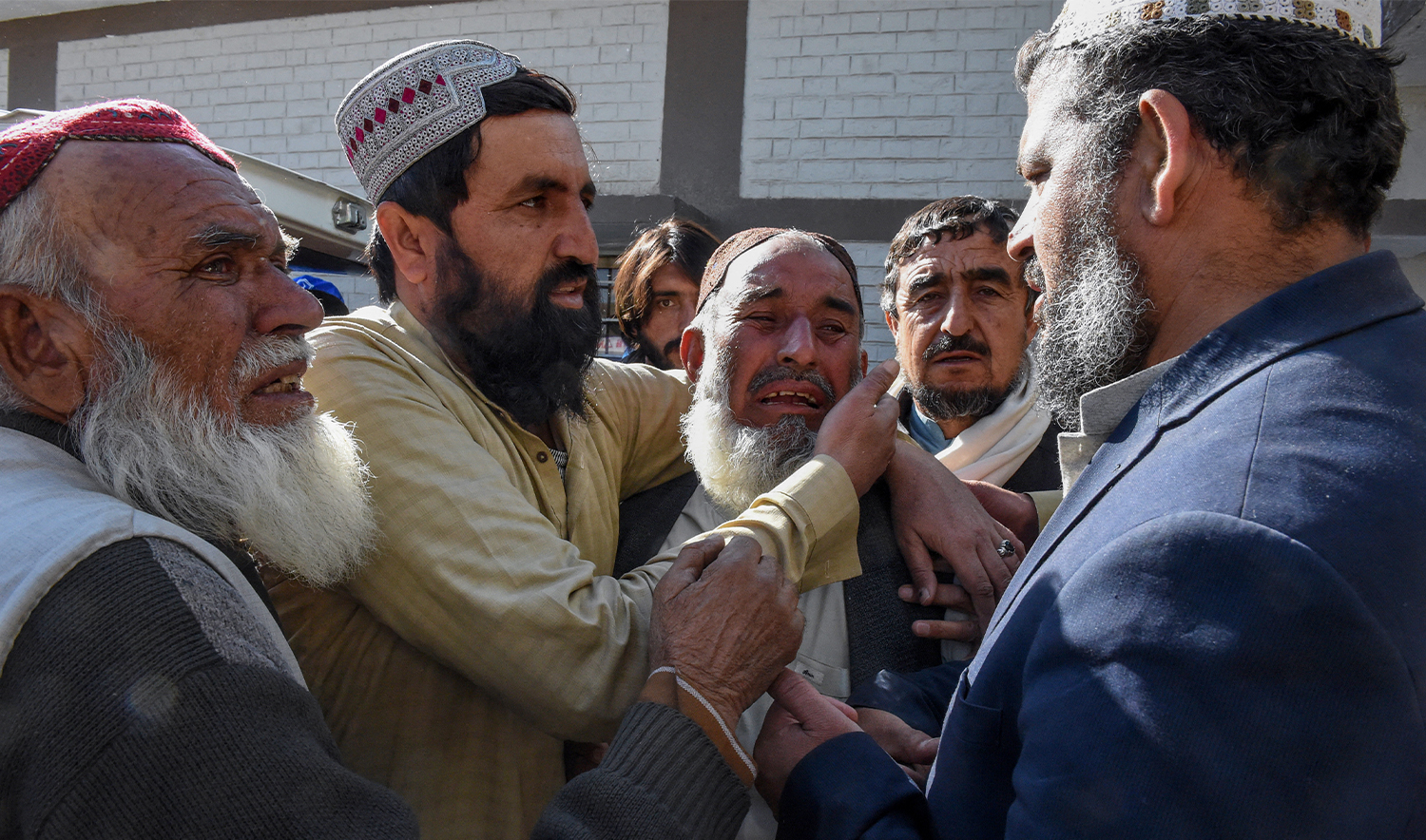 Relatives mourn the death of victims following a bomb blast outside the office of an independent candidate in Pishin district, around 50 kilometres (30 miles) from Quetta on February 7, 2024, on the eve of Pakistan's national elections. (AFP)