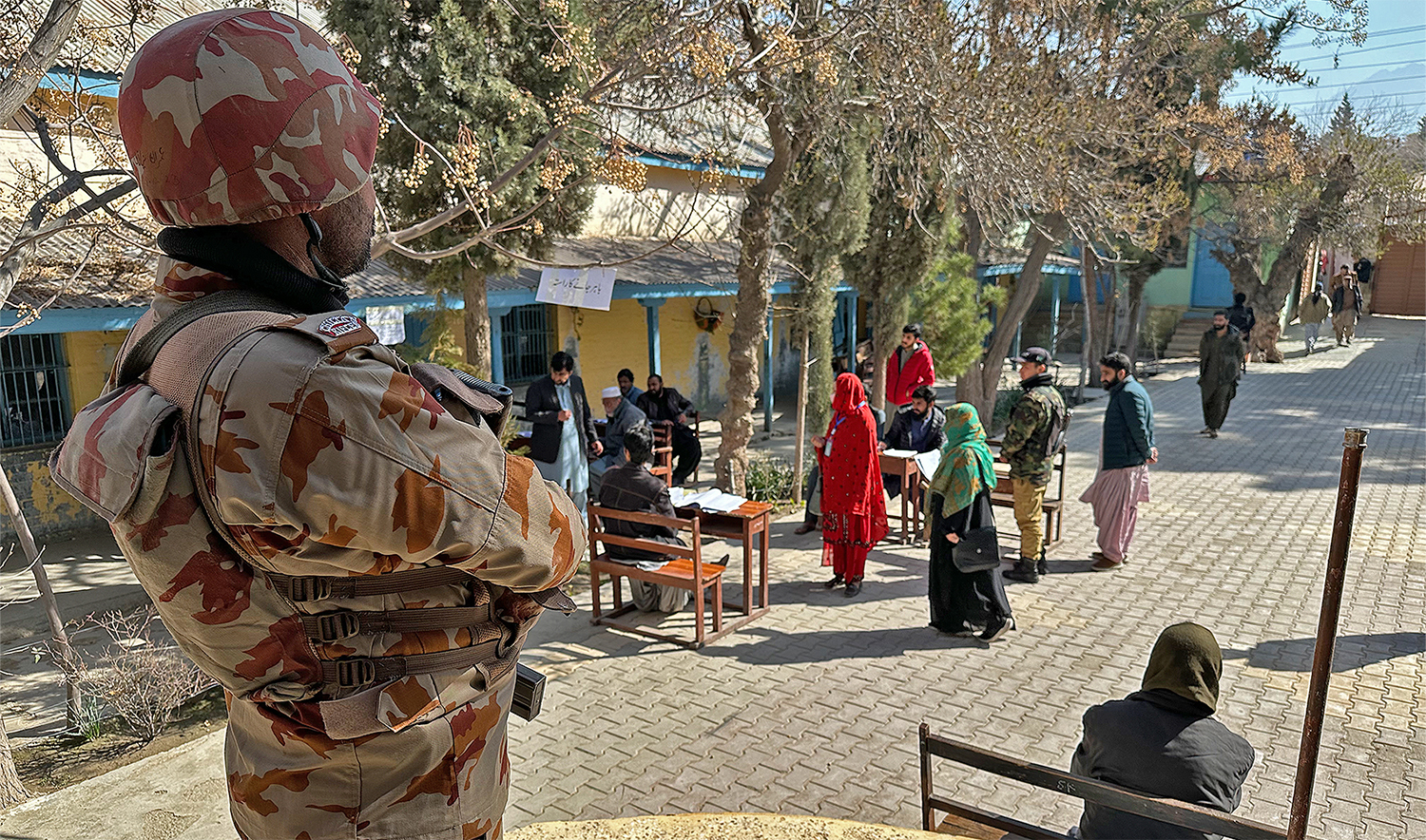 A security personnel stands guard at a polling station in Quetta, Pakistan, on February 8, 2024. (AN photo by Saadullah Akhtar)