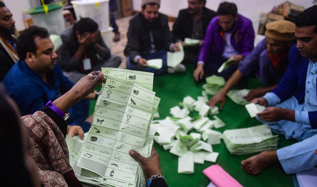 Polling staff start counting votes as polls end during country's national elections in Karachi on February 8, 2024. (AFP)