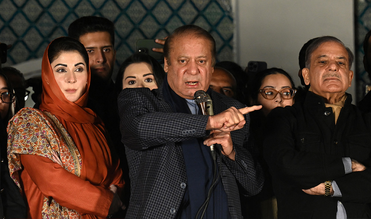 Pakistan's former Prime Minister Nawaz Sharif (C) and leader of the Pakistan Muslim League (PML) party, along with his younger brother and former prime minister Shehbaz Sharif (R) and his daughter Maryam Nawaz (L) speaks with supporters in Lahore on February 9, 2024, a day after Pakistan's national elections. (AFP)