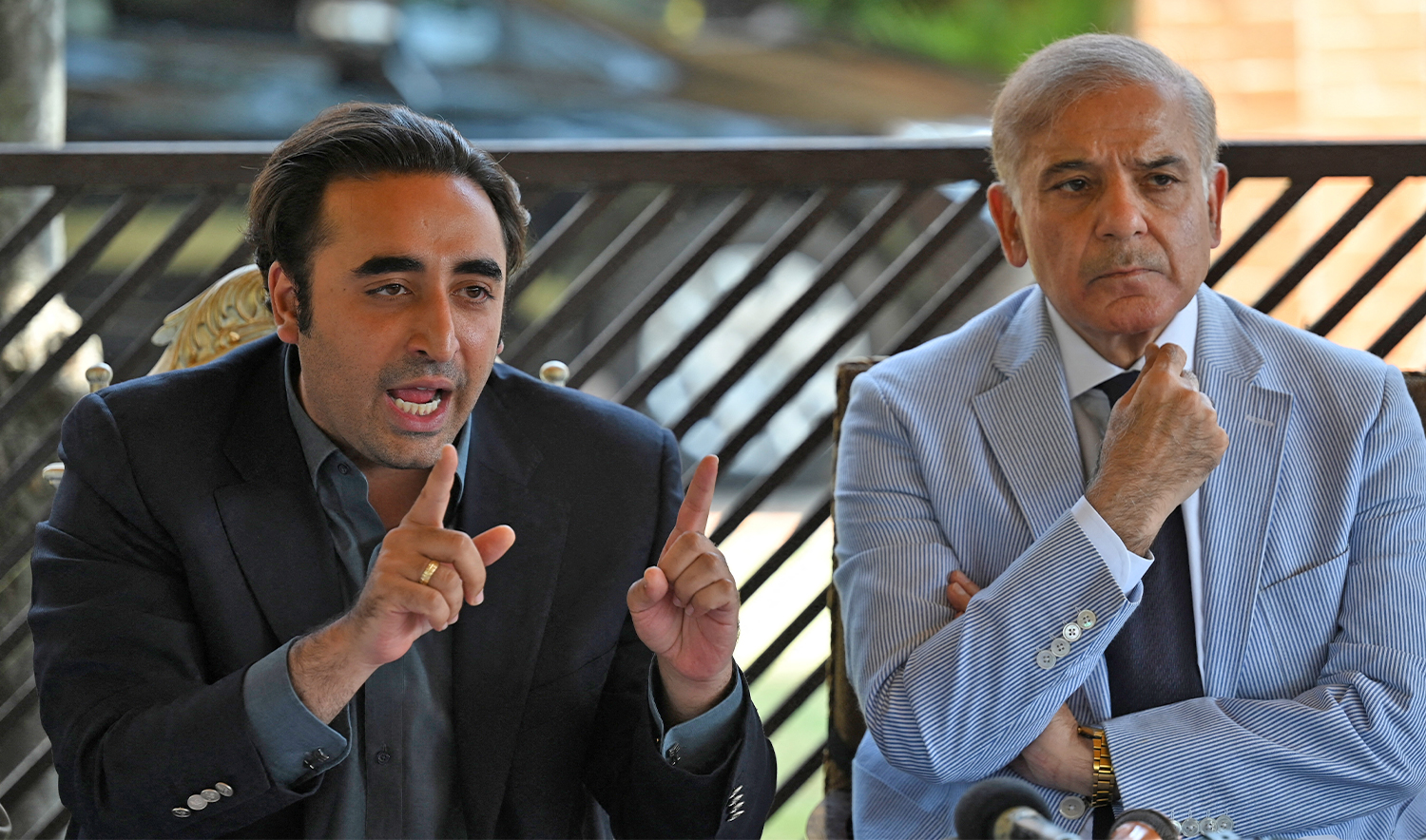 Pakistani politicans Shehbaz Sharif (R) and Bilawal Bhutto Zardari (L) speak during a press conference in Islamabad on April 4, 2022. (AFP/File)