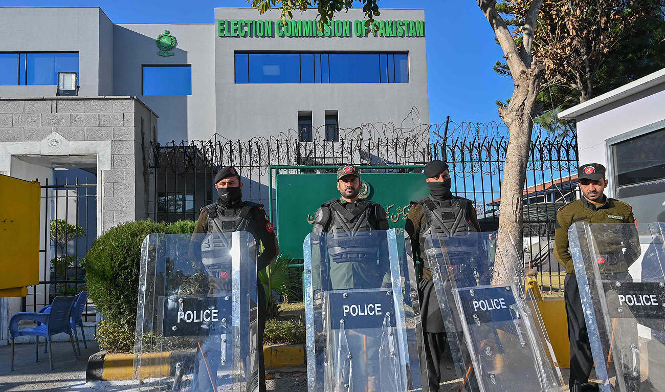 Pakistan Frontier Constabulary (FC) personnel stand guard in front the Election Commission office in Islamabad on February 9, 2024, a day after national elections were held in the country. (AFP)