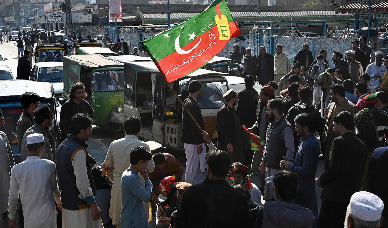Supporters of the Pakistan Tehreek-e-Insaf (PTI) protest outside a temporary election commission office in Peshawar on February 10, 2024, amid claims the election result delay is allowing authorities to rig the vote-counting. (AFP)
