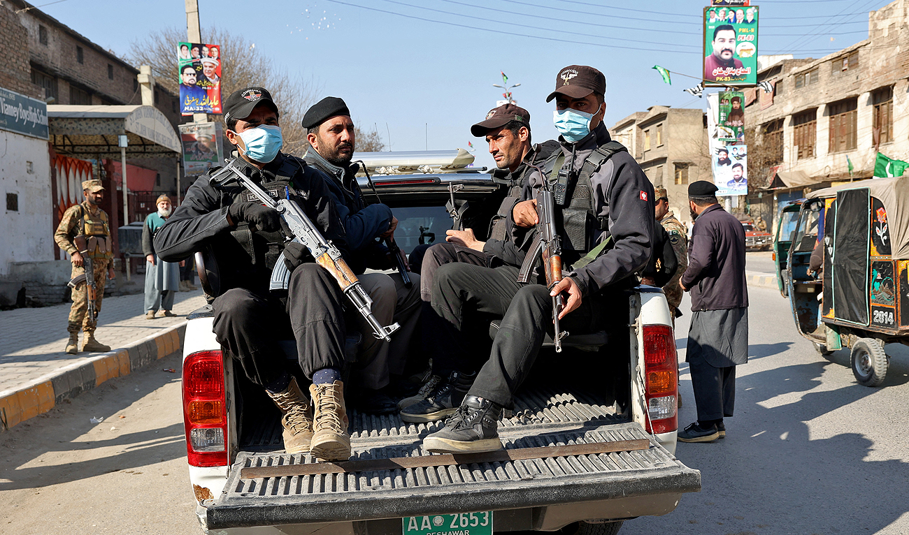 Military troops patrol during Pakistan's national elections in Peshawar on February 8, 2024. (AFP)