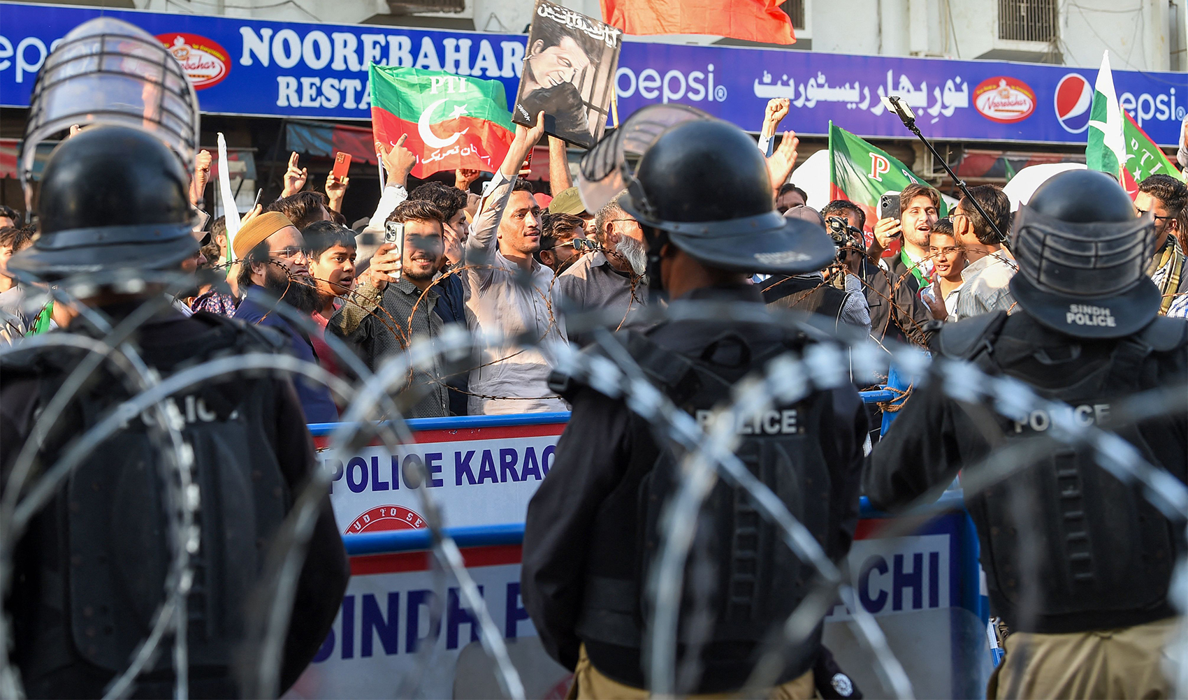 Supporters of Khan's Pakistan Tehreek-e-Insaf (PTI) party protest against the alleged skewing in Pakistan's national election results, in Karachi, Pakistan, on February 11, 2024. (AFP)