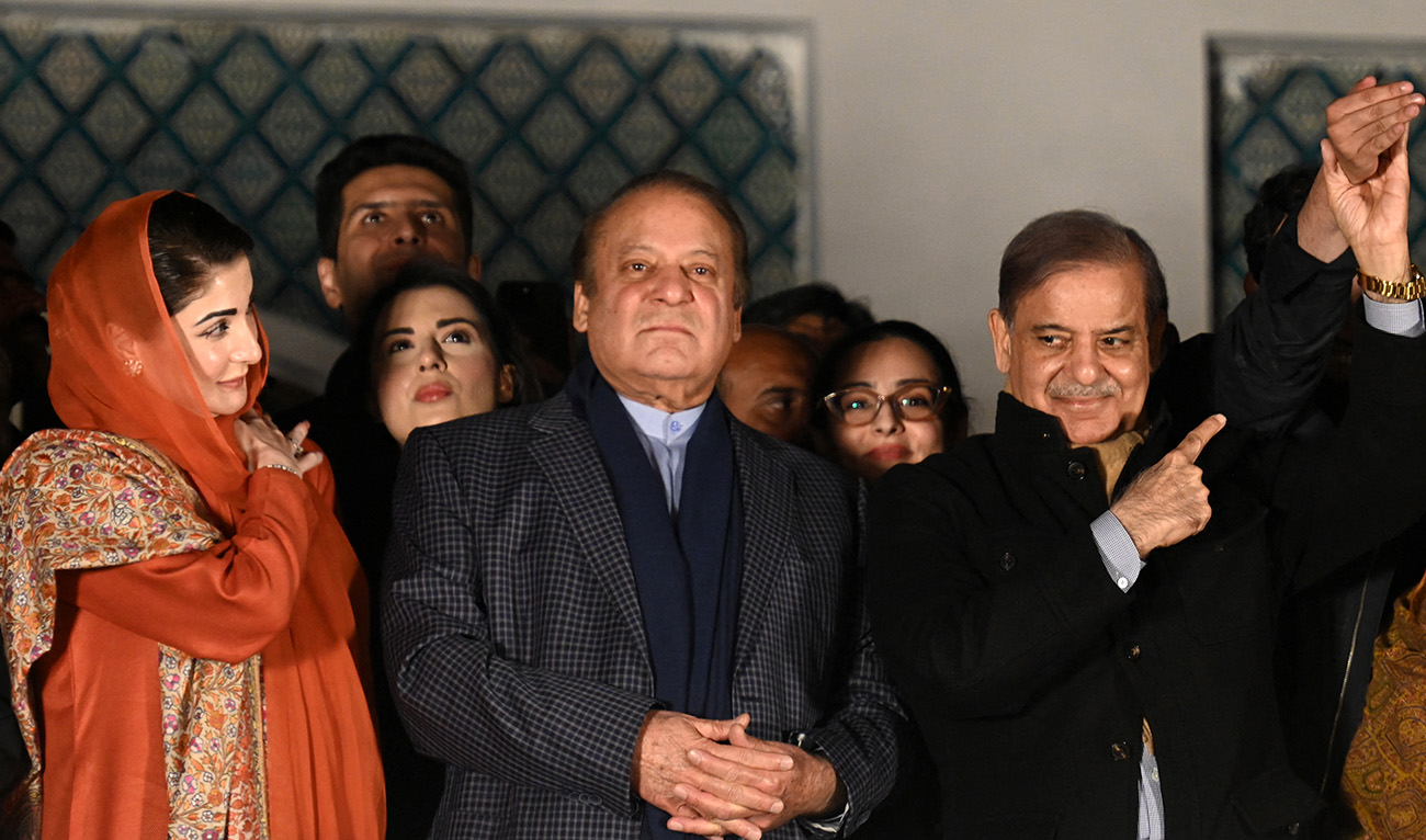 Pakistan's former Prime Minister Nawaz Sharif (C) and leader of the Pakistan Muslim League (PML) party, along with his younger brother and former prime minister Shehbaz Sharif (R) and his daughter Maryam Nawaz (L) attend a gathering with supporters in Lahore on February 9, 2024, a day after Pakistan's national elections. (AFP/File)