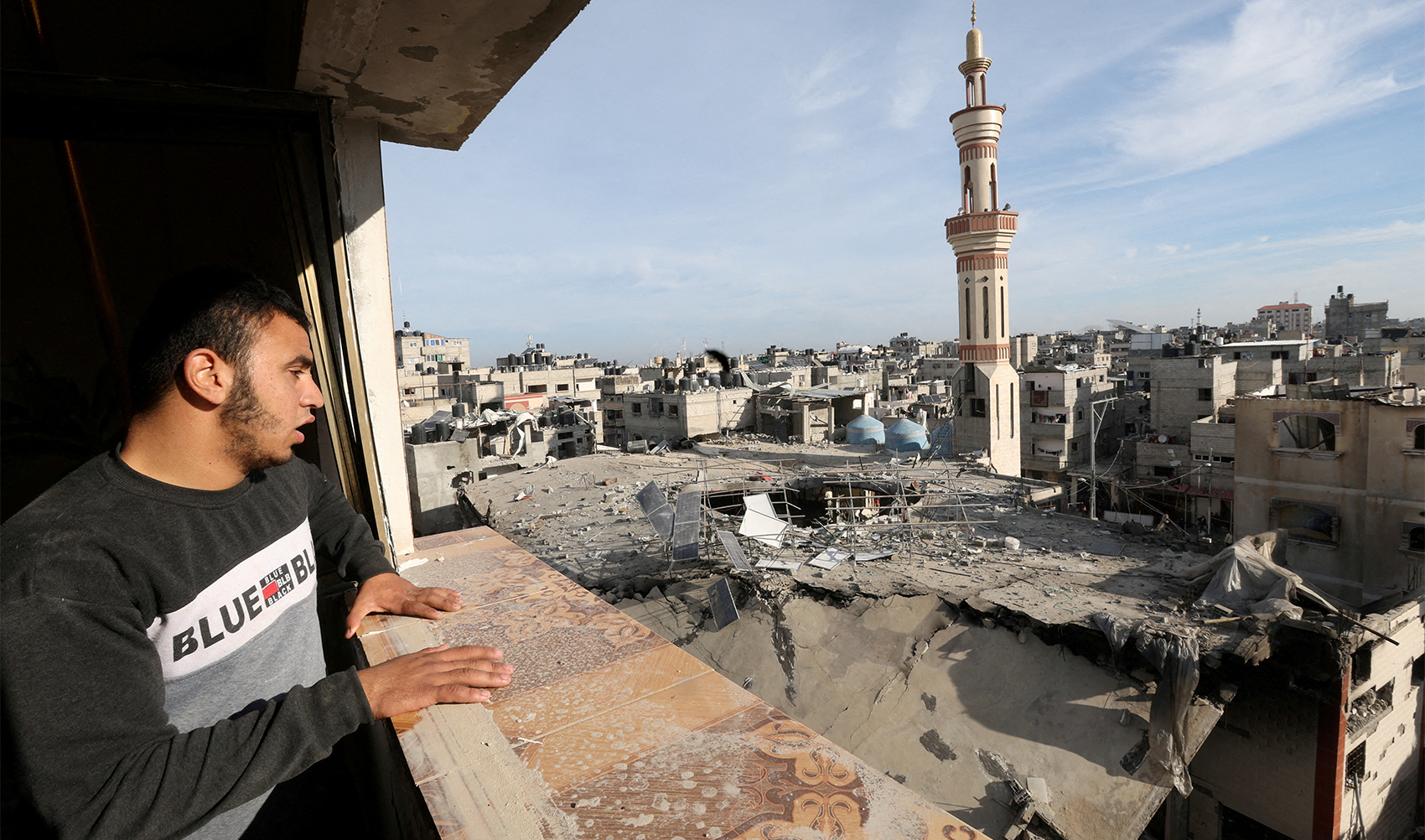 A Palestinian man looks at the site of an Israeli strike on a mosque, amid the ongoing conflict between Israel and the Palestinian Islamist group Hamas, in Rafah in the southern Gaza Strip, on February 12, 2024. (REUTERS)